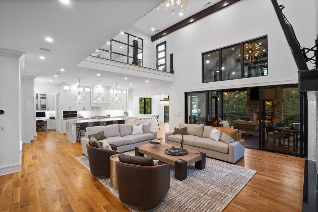 Two-story great room with sputnik chandelier and floor-to-ceiling windows